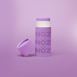 Load image into Gallery viewer, Noz&#39; purple nose sunscreen with the cap open and leaning up against the side of the cylinder sunscreen container, with a light purple background.
